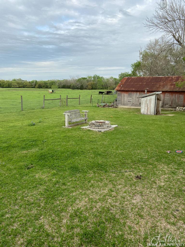 A farm with a rusted barn in Round Top Texas
