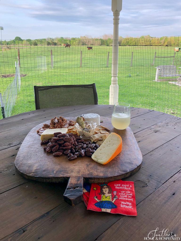 A charcuterie board on the patio of a farmhouse in Round Top Texas