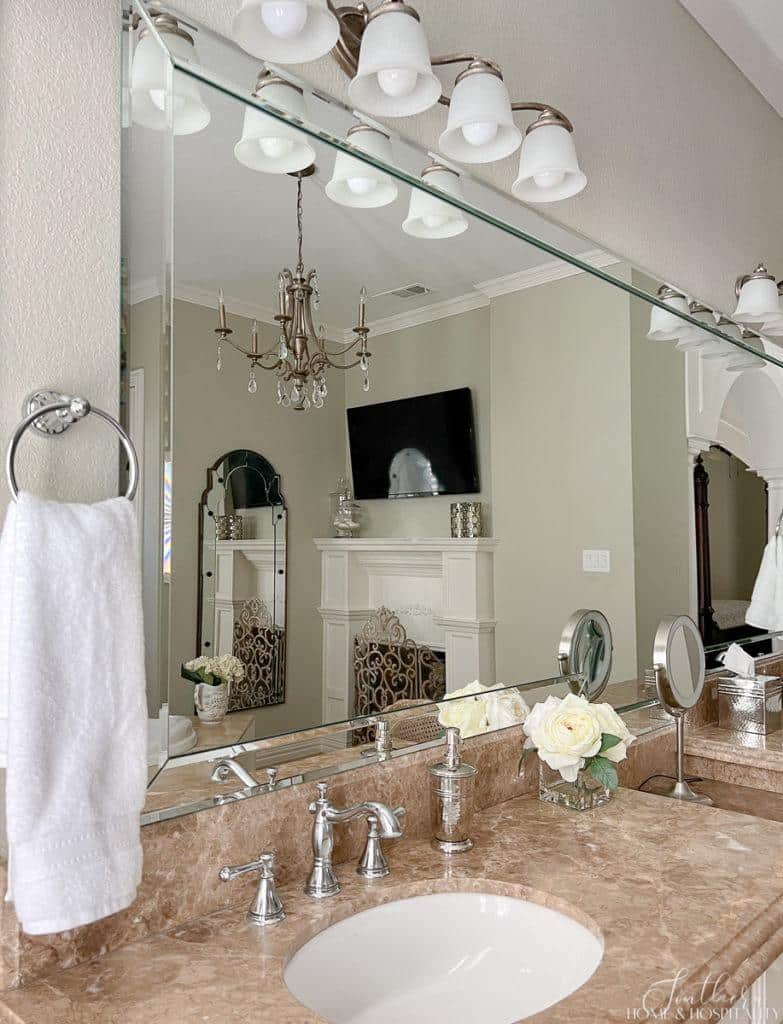French country bathroom counter with light emperador marble