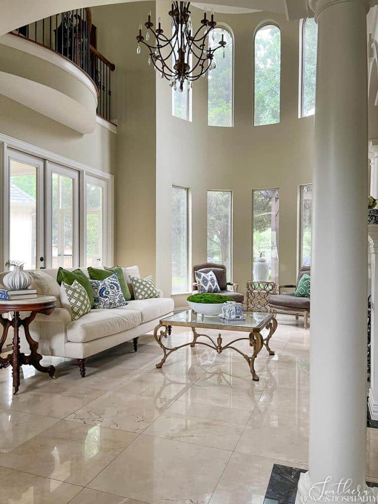 Southern traditional two story living room with curved window wall