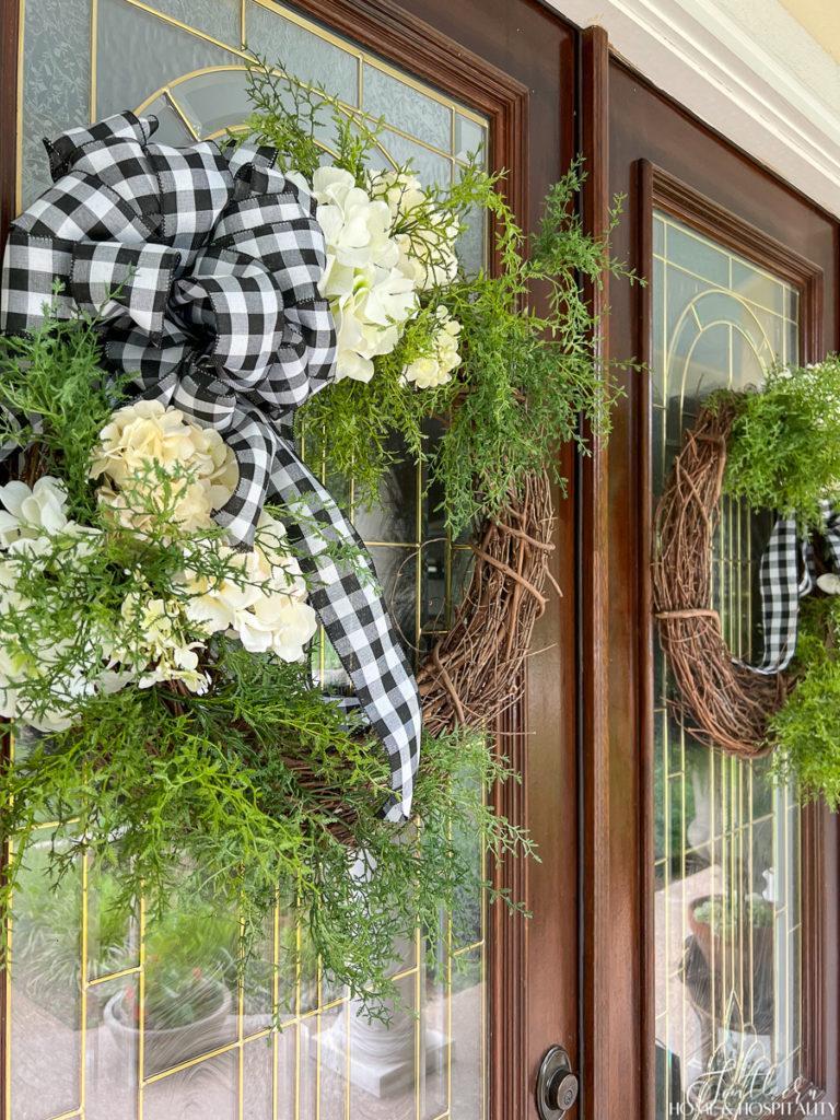 Summer hydrangea and fern grapevine door wreaths with black and white gingham bow