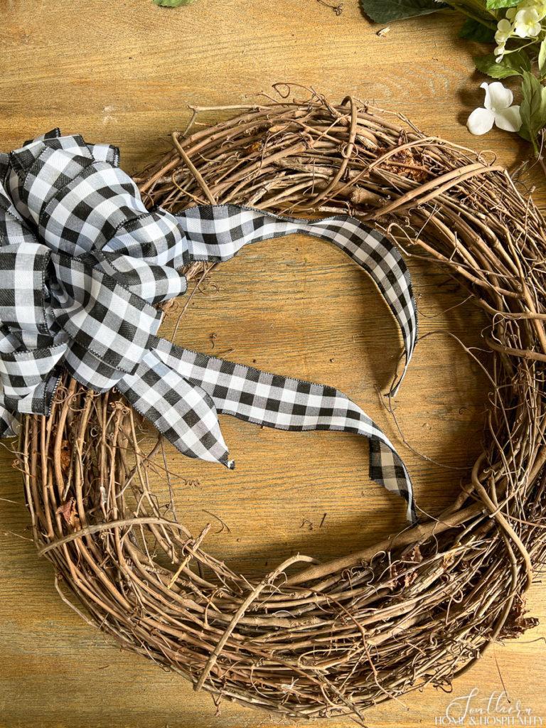 black and white gingham bow on grapevine wreath