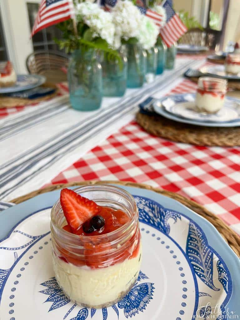 red, white, and blue dessert in a mason jar