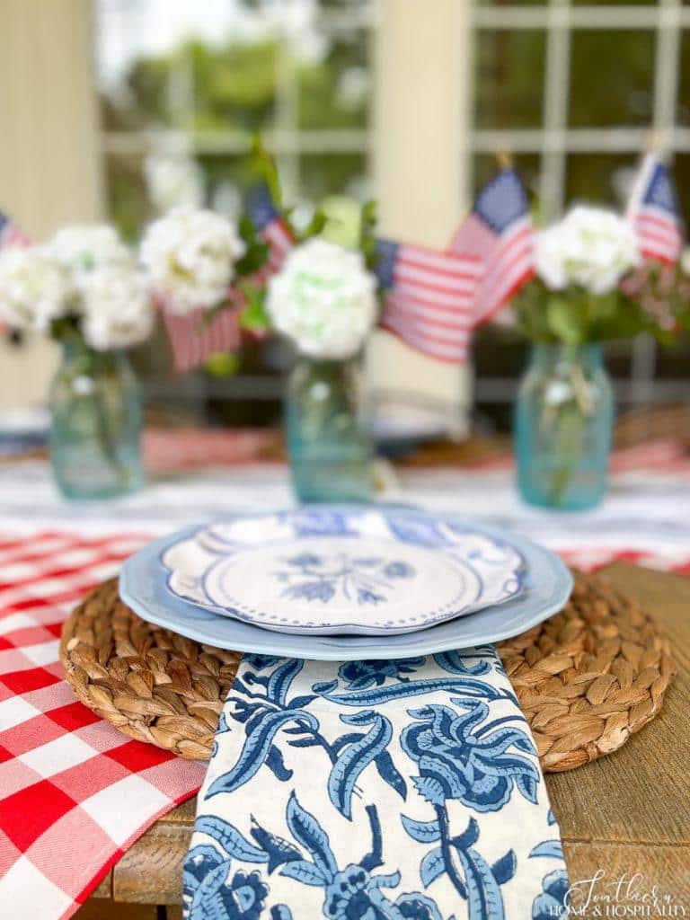 Blue and white floral fabric napkins on a 4th of July table
