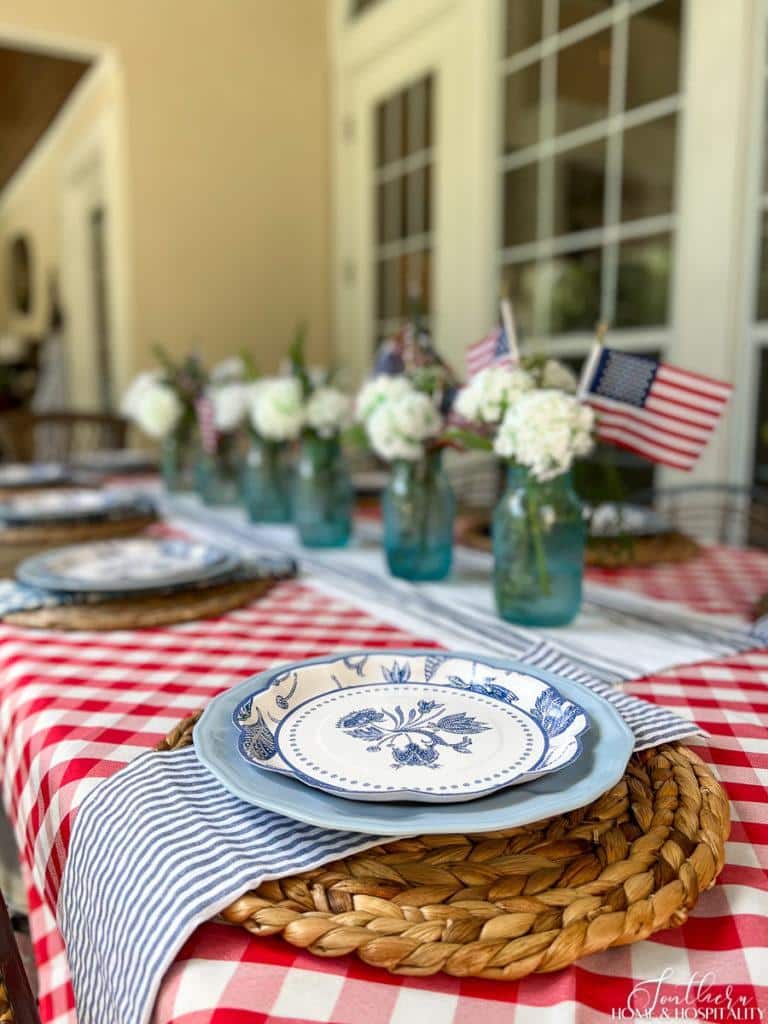Blue and white floral plates in an elegant Fourth of July tablescape