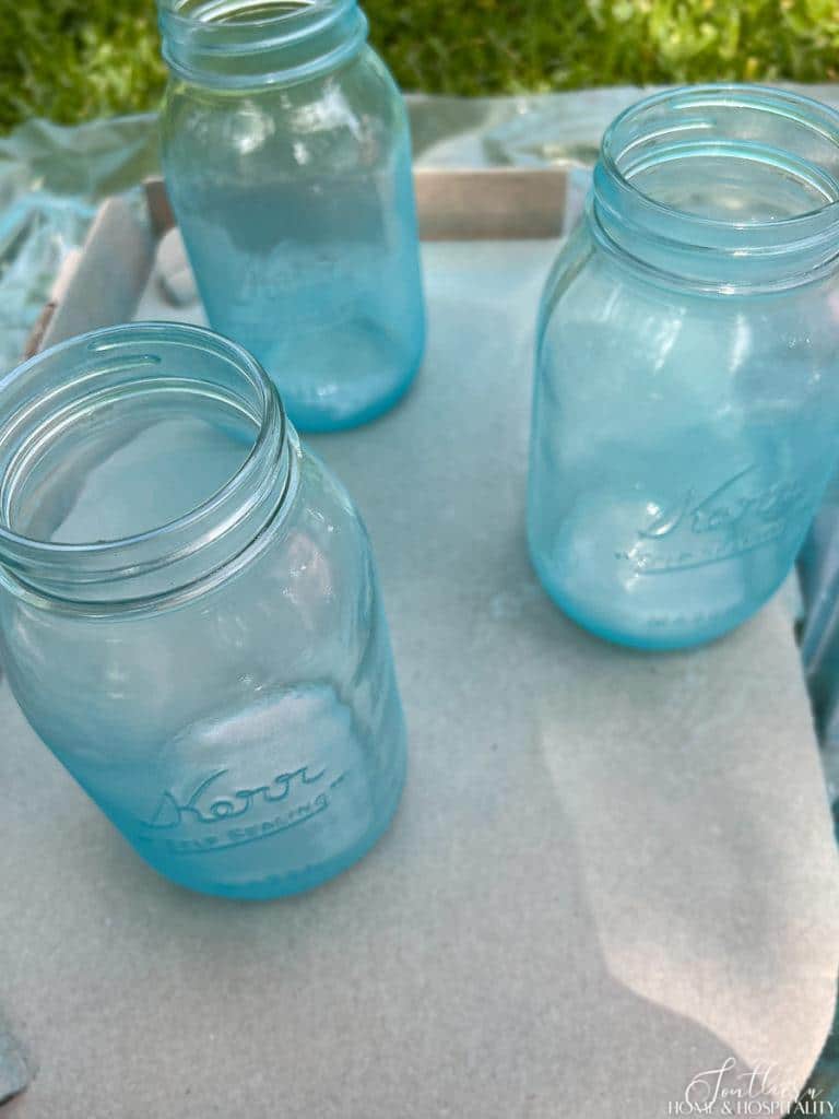 Mason jars with light blue sea glass paint
