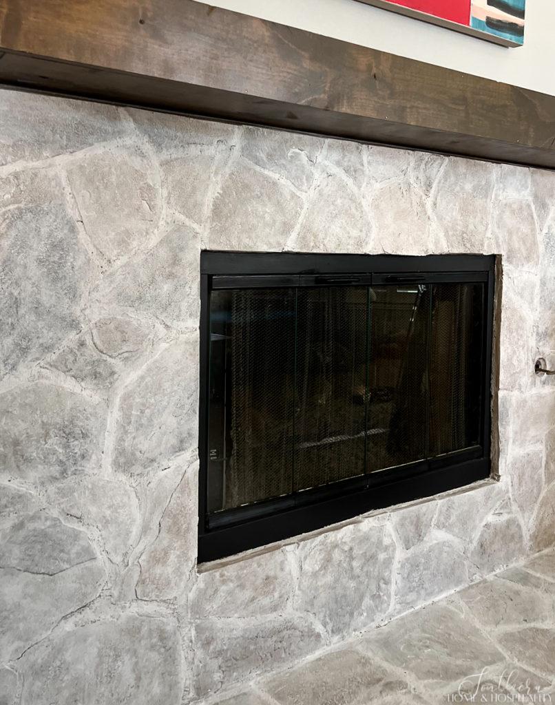 Whitewash on stone fireplace