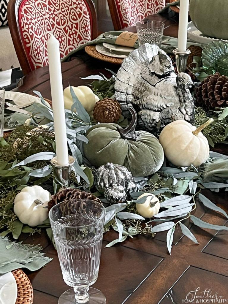 Thanksgiving tablescape with faux aged metal pumpkins and turkey