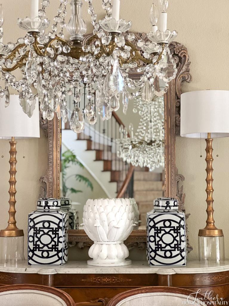 artichoke planter painted to look like white ceramic glazed pottery on French dining room sideboard