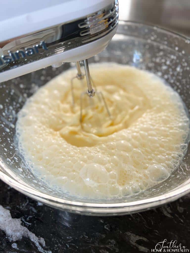 mixing pudding mix and milk with a hand mixer
