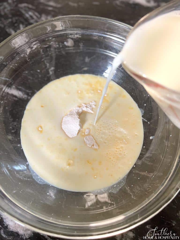 pouring milk into pudding mix