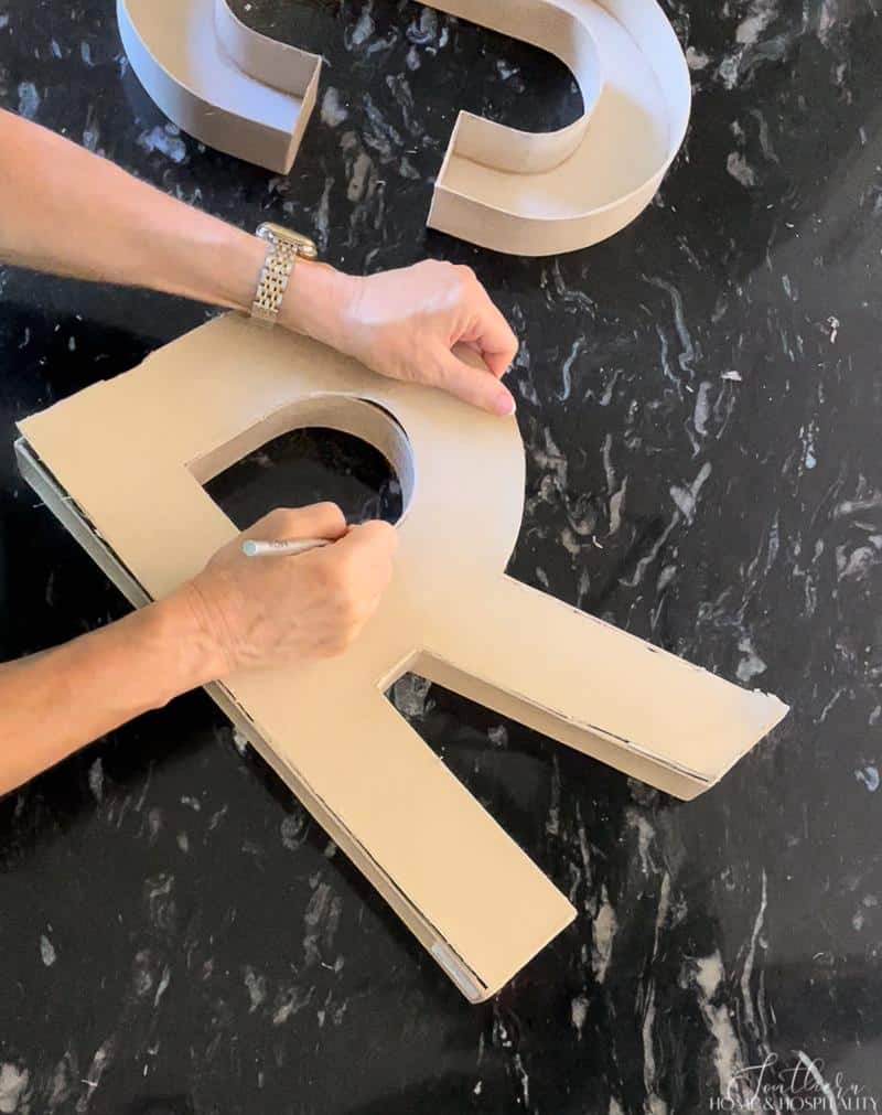 cutting paper mache letters to make treat boxes