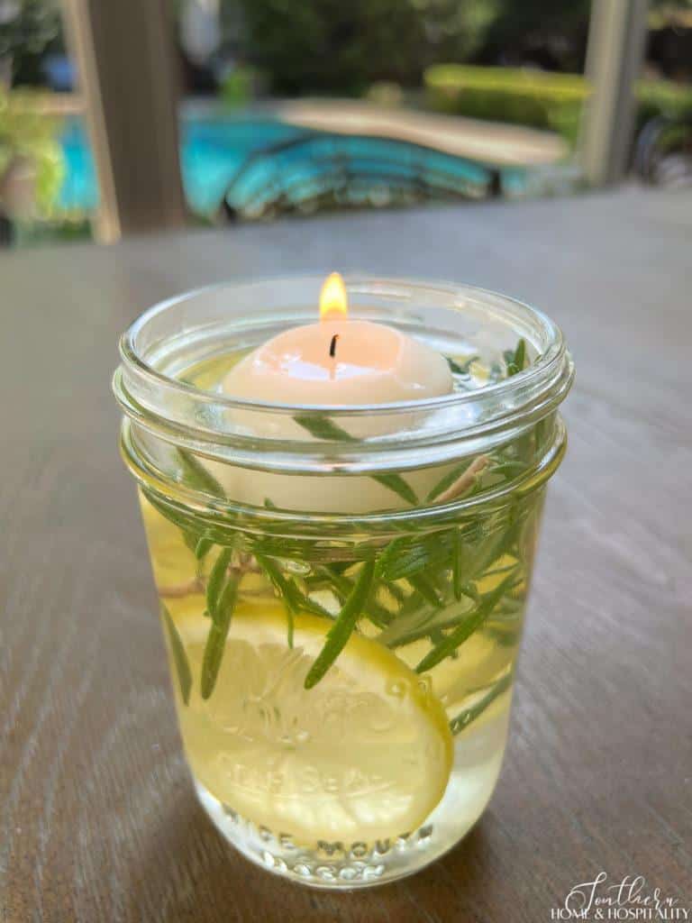 Mosquito repellent mason jar candle with rosemary and lemons