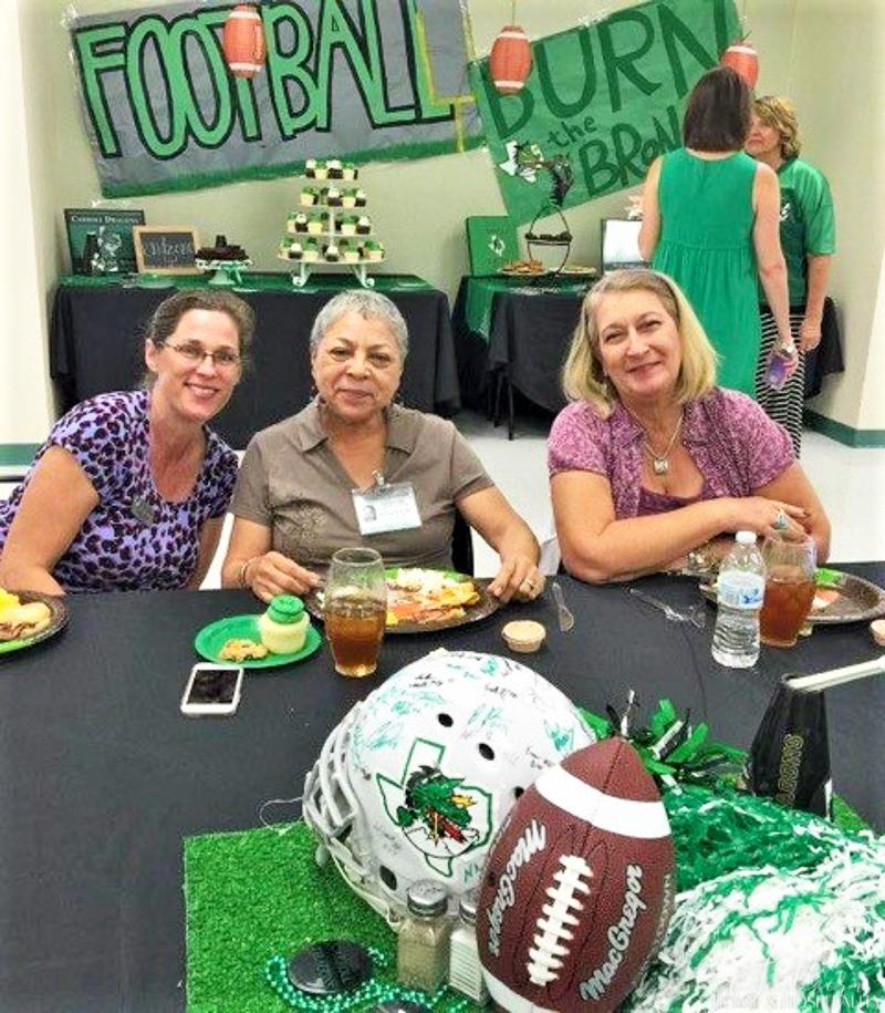 guests at football theme party with centerpiece
