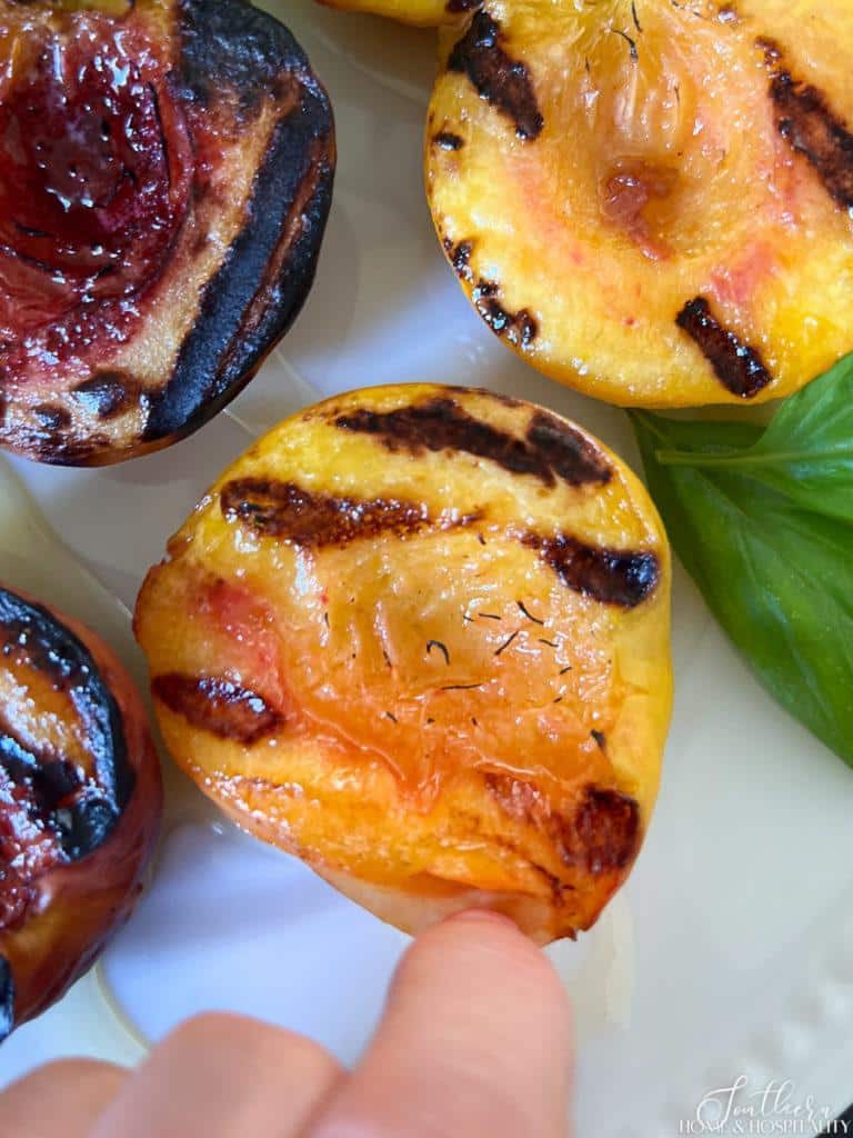 grilled peach with skin pulling away