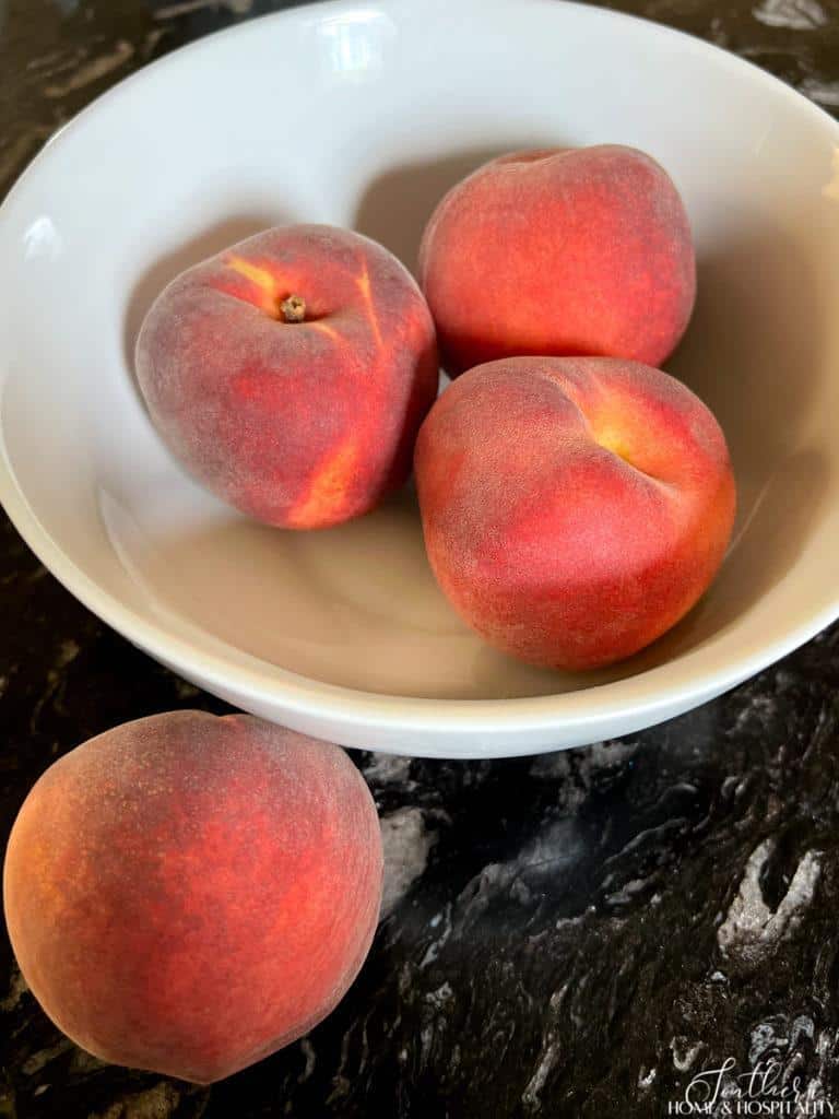 Peaches in a white bowl