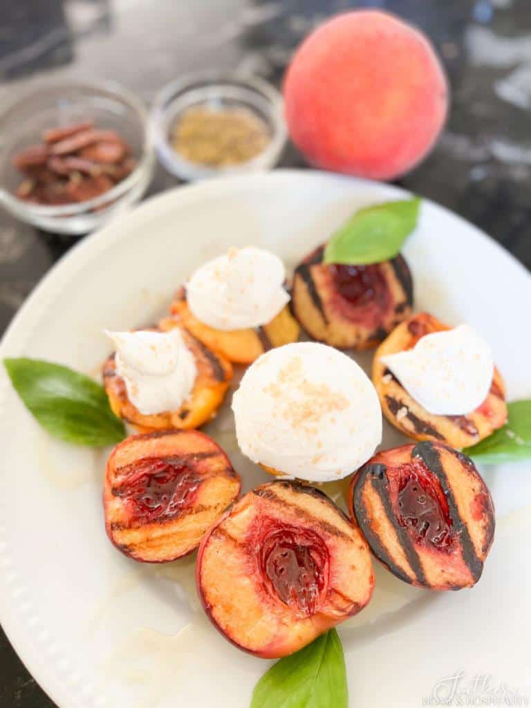 Grilled peaches with ice cream and cream