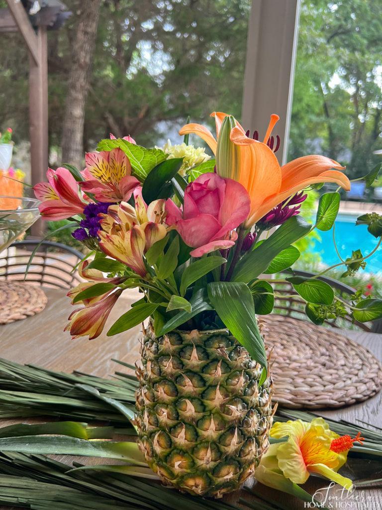 Pineapple vase flower arrangement