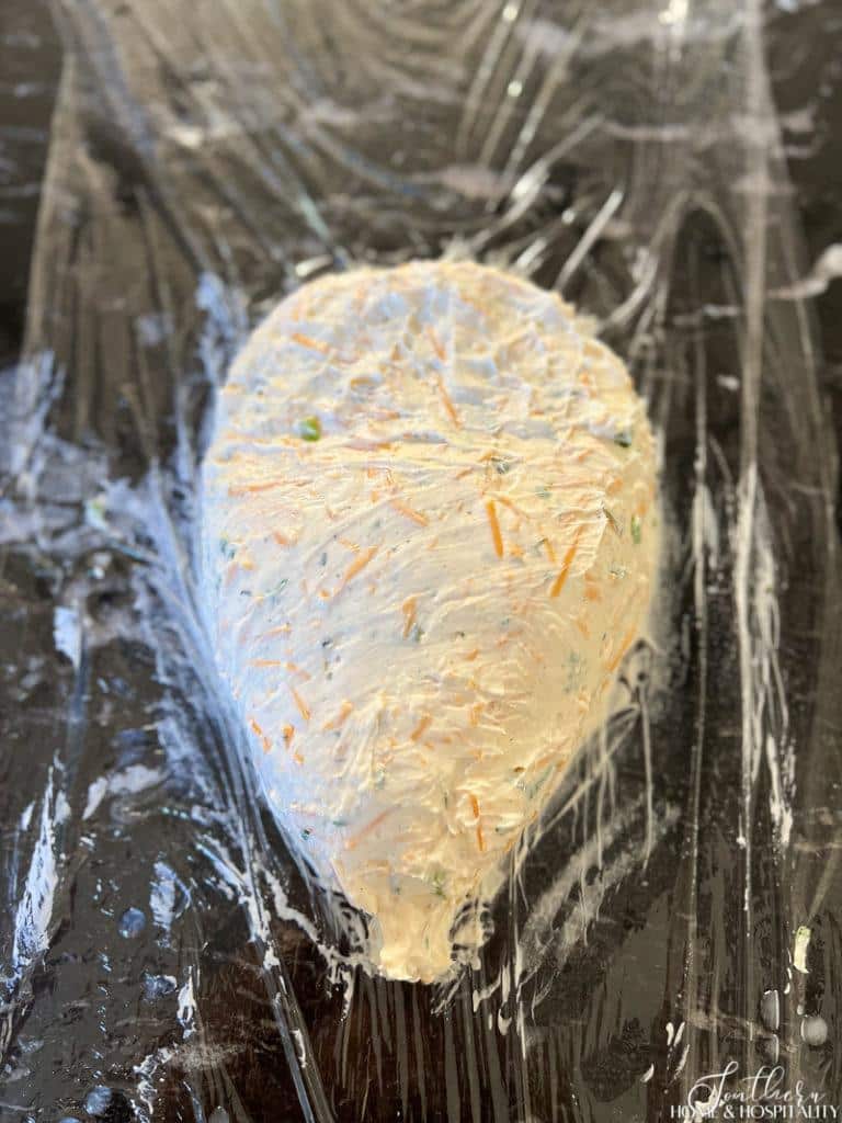 cheese ball mixture formed into acorn shape