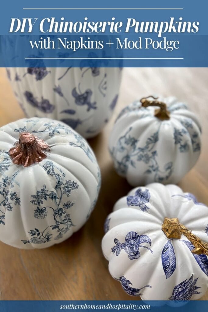Blue and white DIY chinoiserie decoupage pumpkins with gold stems displayed on a wood table.