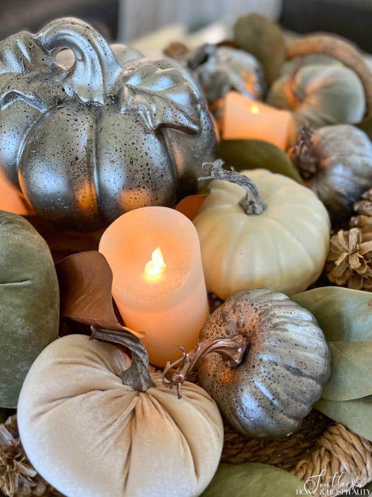 flameless pillar candle and metal and velvet pumpkins