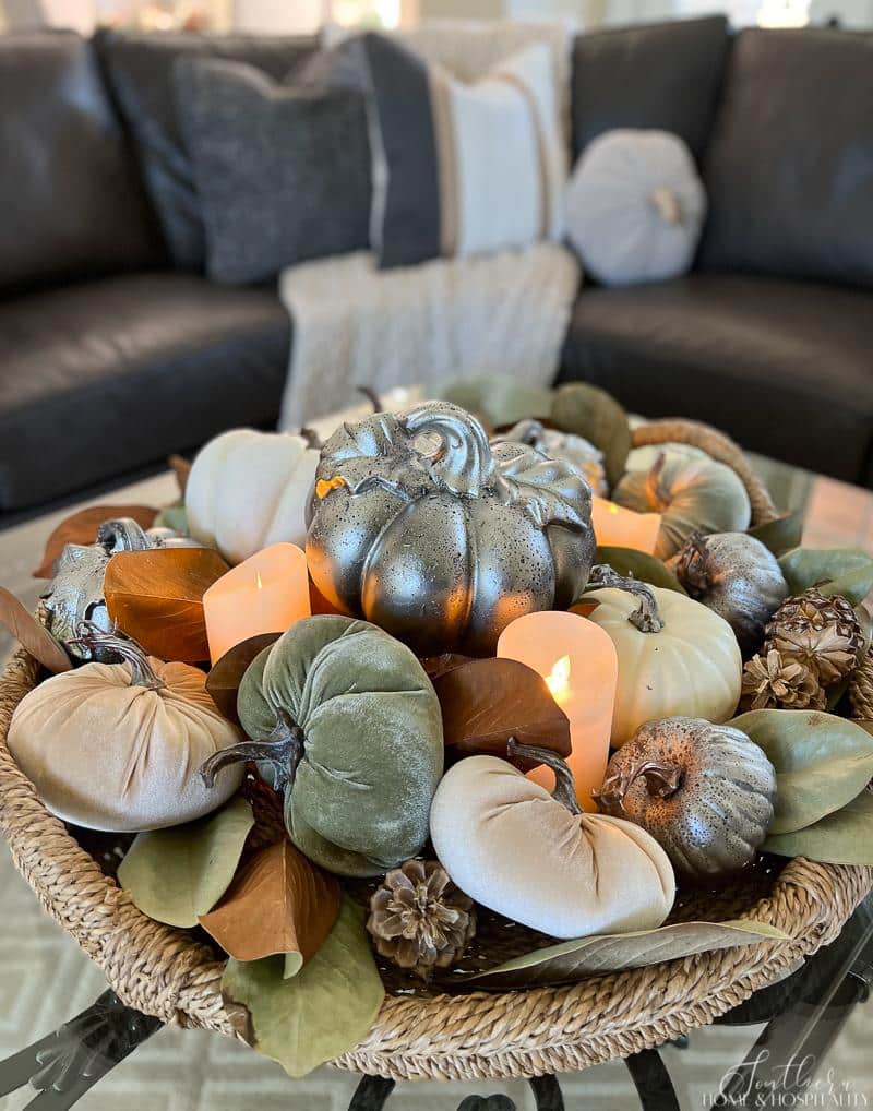 pumpkins and magnolia leaves in a tray