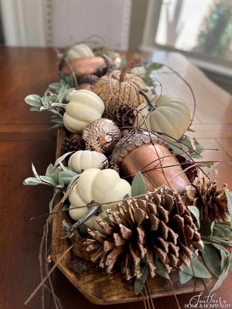 pinecones, pumpkins, acorns in dining table centerpiece