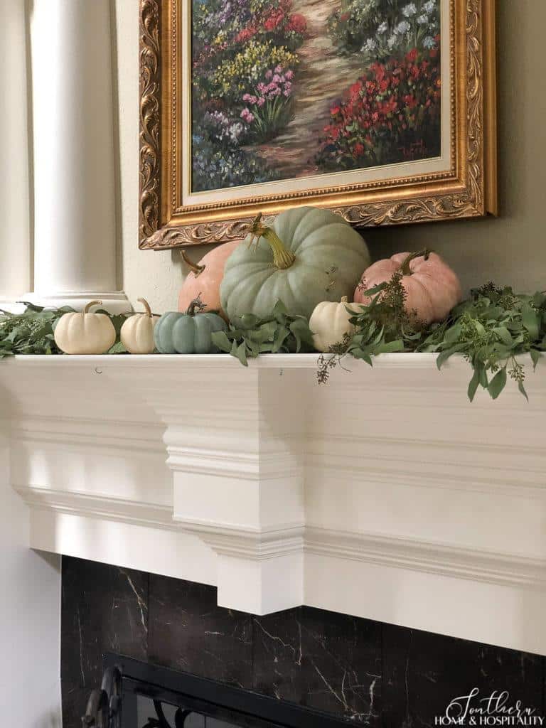 Heirloom pumpkins and eucalyptus on fall mantel