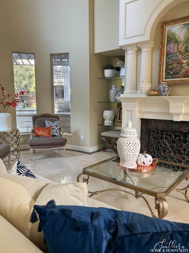Blue and white with orange fall decor in living room