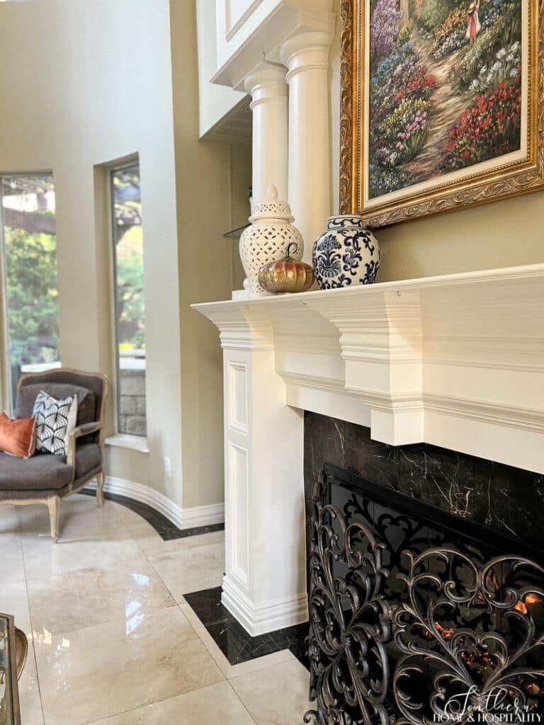 Chinoiserie ginger jar, white ginger jar, and copper pumpkin on mantel