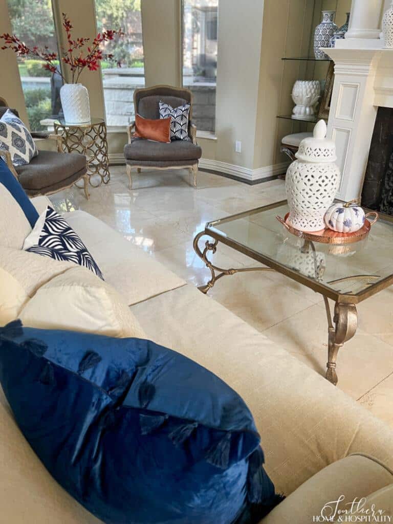 Blue velvet pillow in living room decorated for fall