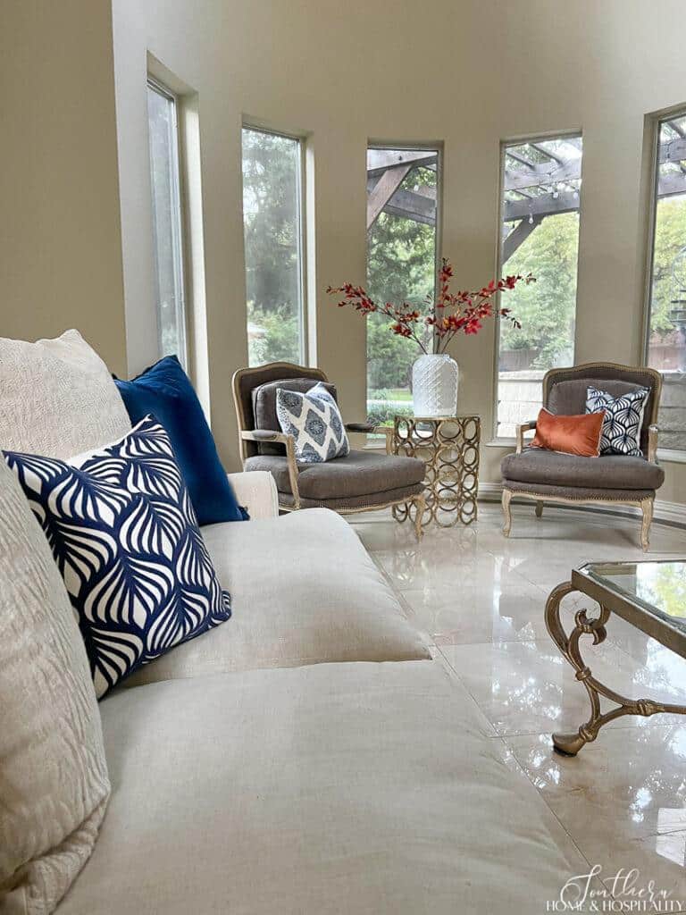 Blue and white throw pillows in fall living room