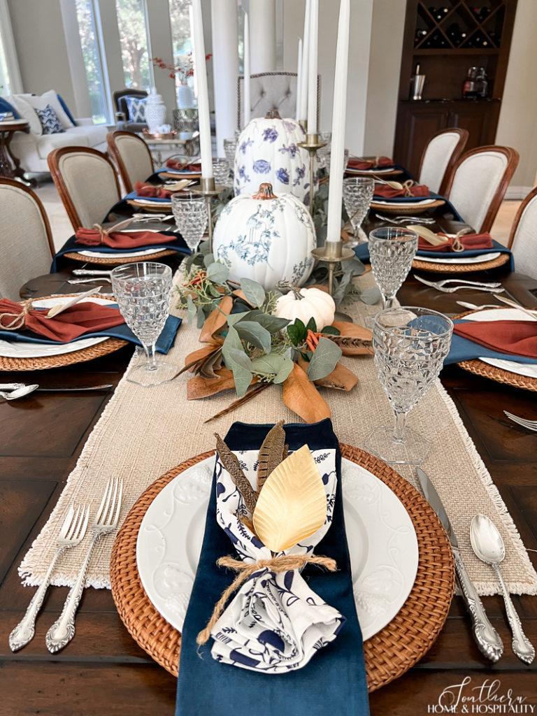 fall place setting with blue and white napkins