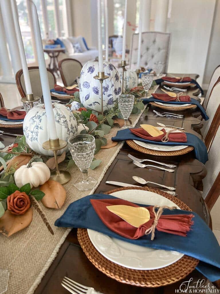 fall dining tablescape with navy and rust