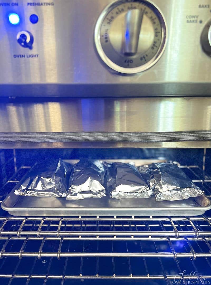 Salmon foil packets baking in the oven