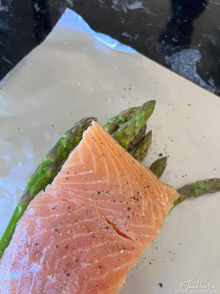 Salmon filet on top of asparagus spears