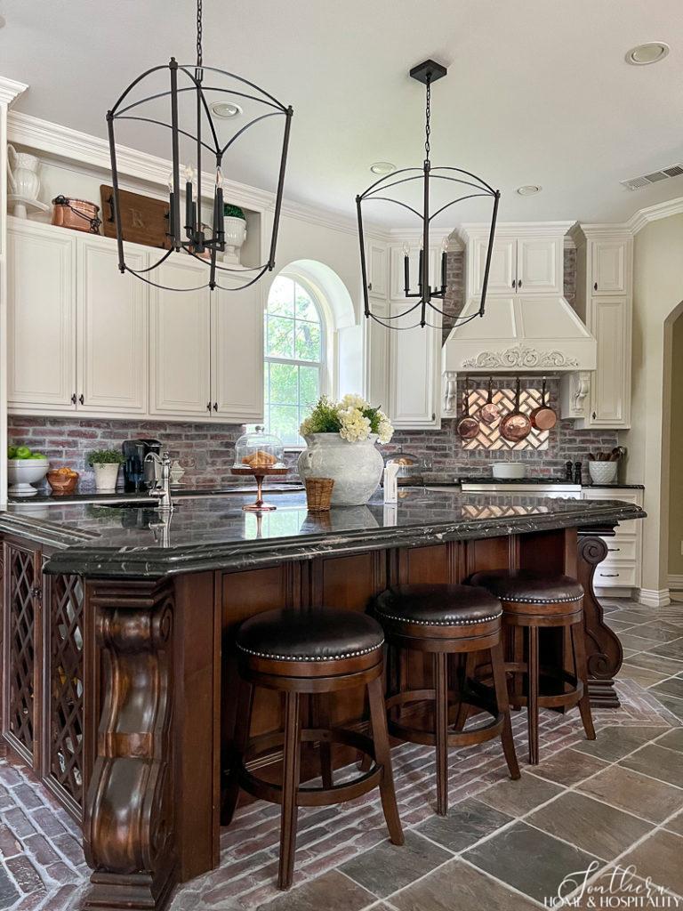 two large cage pendants hung over kitchen island