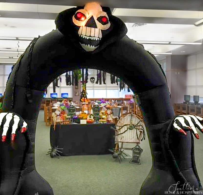 Large grim reaper inflatable at Halloween party entrance