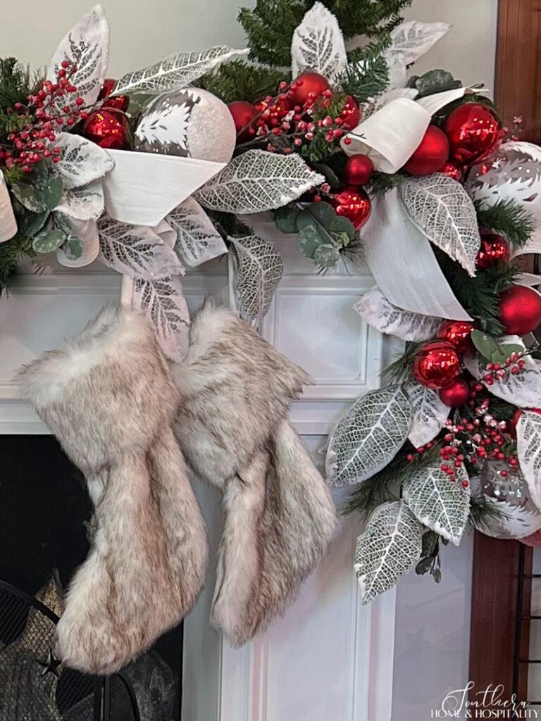 Faux fur stockings hung on the mantel