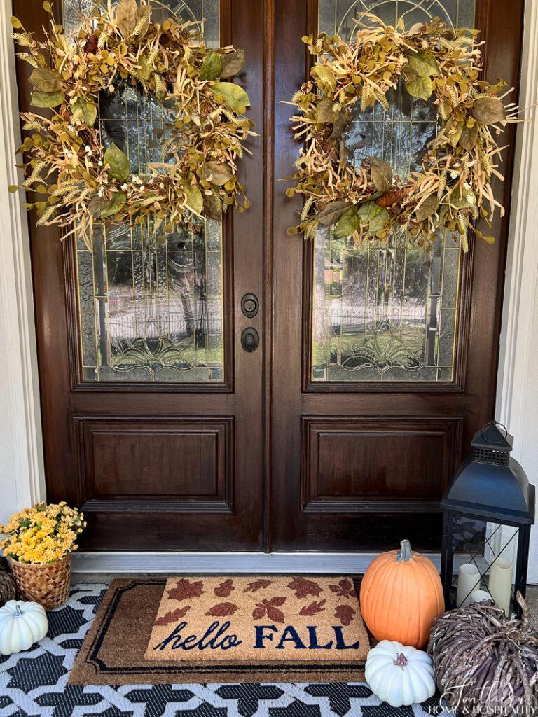 Front double doors decorated with fall wreaths