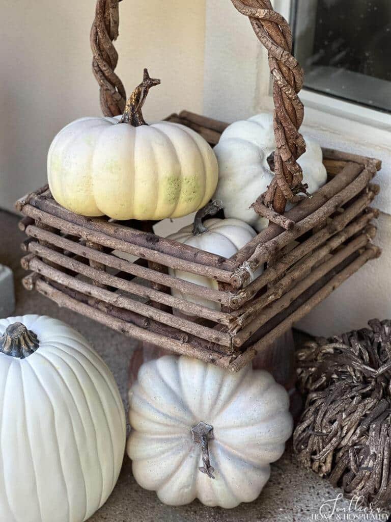 Twig basket of white pumpkins