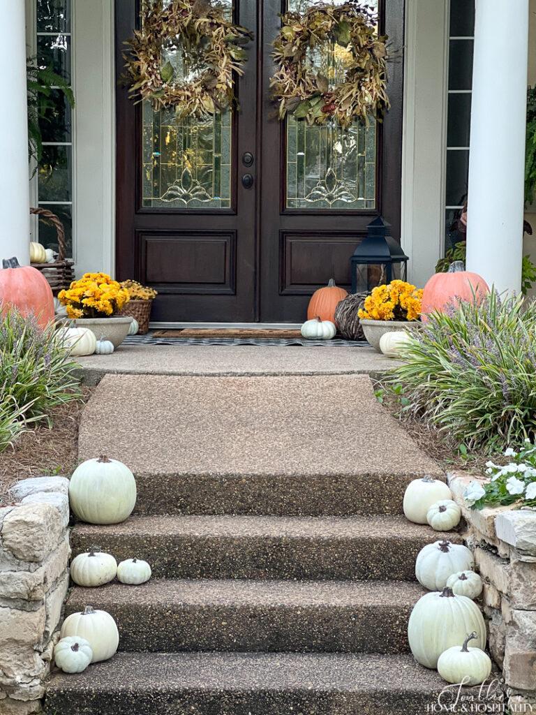 Faux white pumpkins for front porch fall decorating on a budget