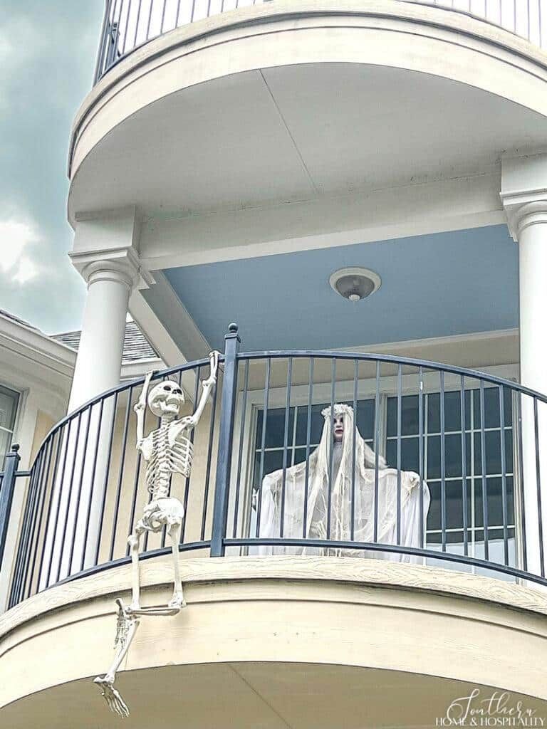 Skeleton hanging on balcony, Halloween ghost