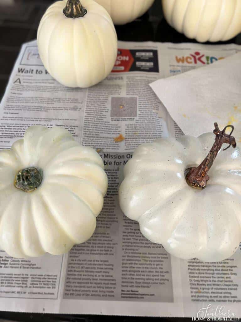 White faux pumpkins before and after yellow wax