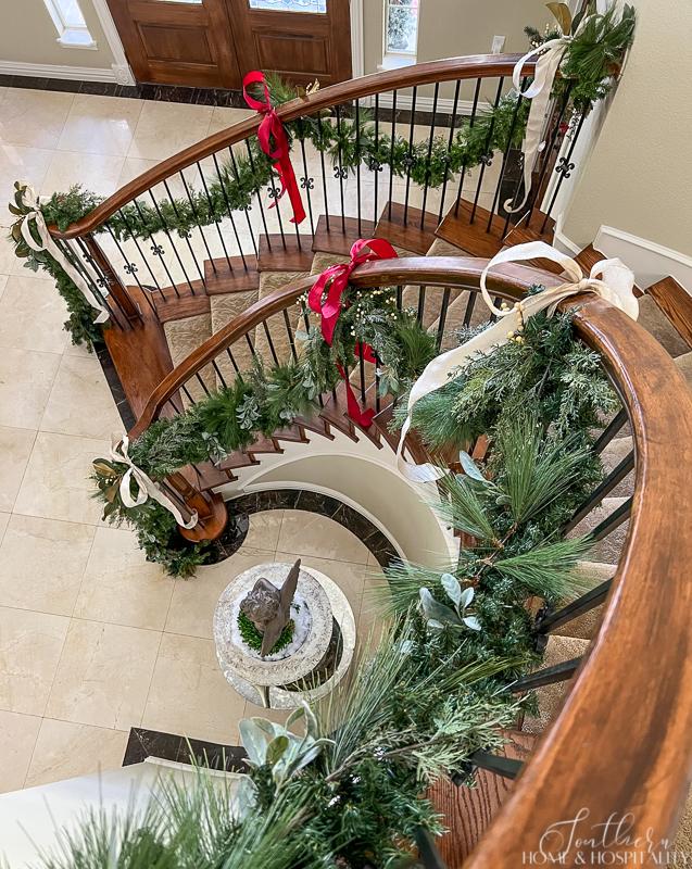 Curved staircase with Christmas garland