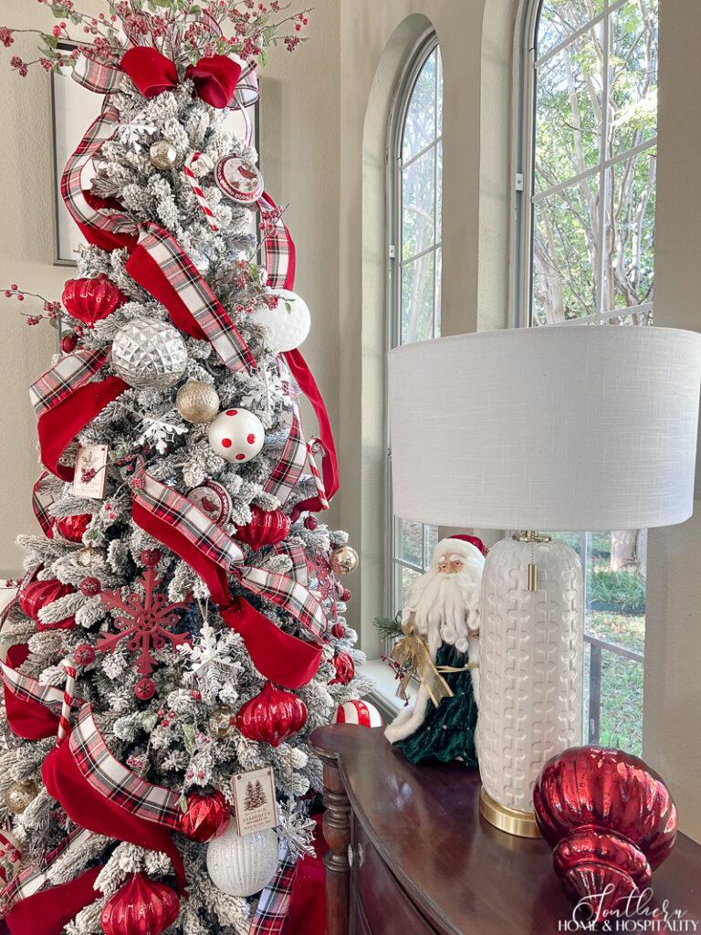 Flocked Christmas tree decorated with red and plaid