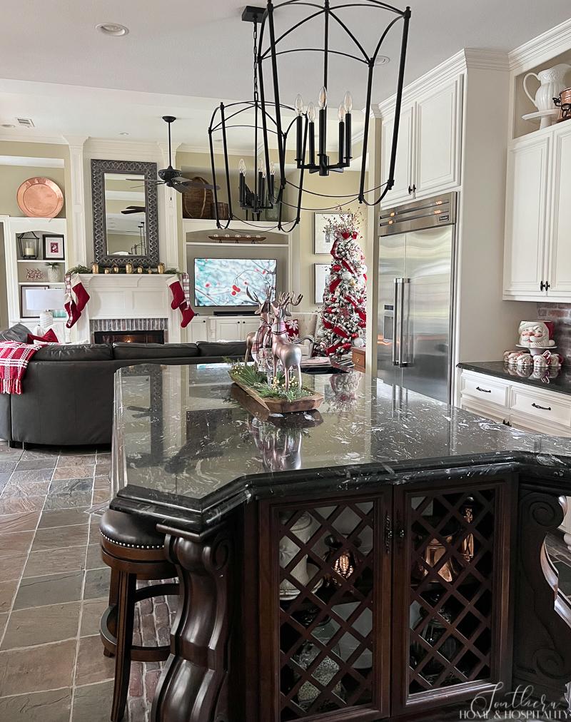 Kitchen and family room with cozy red and plaid Christmas decorations