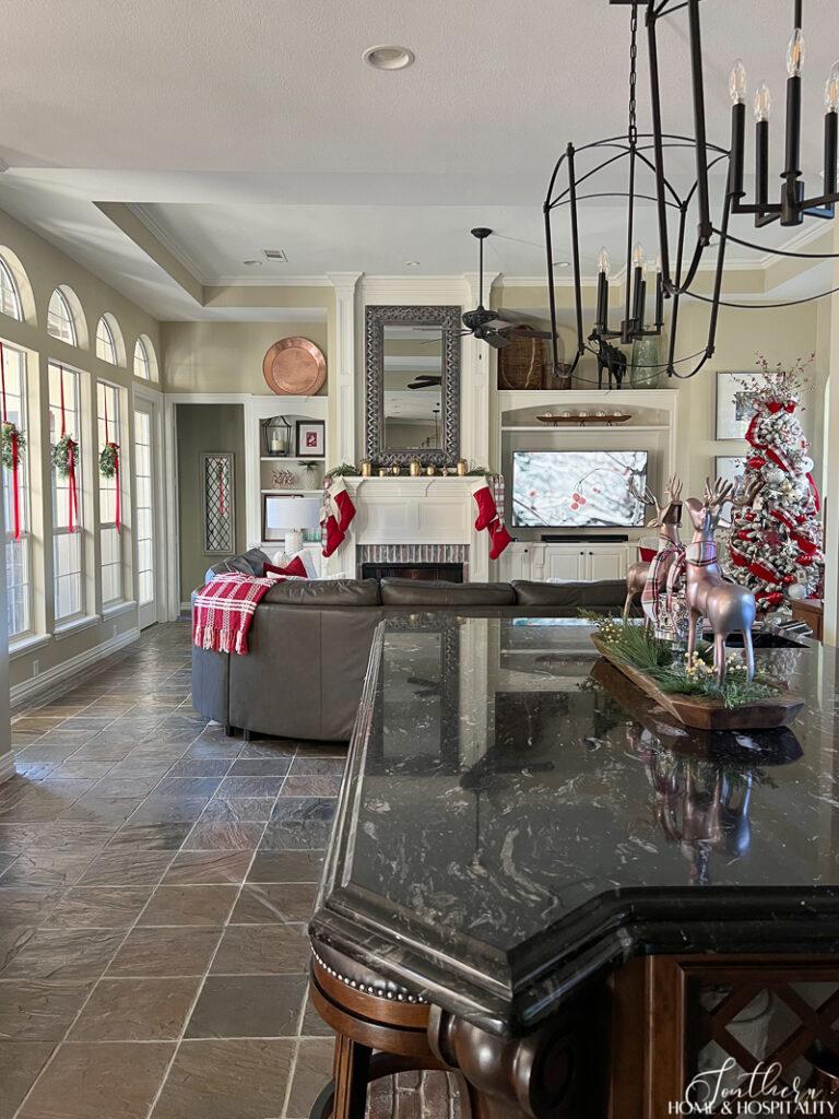 Open concept kitchen and family room decorated for Christmas