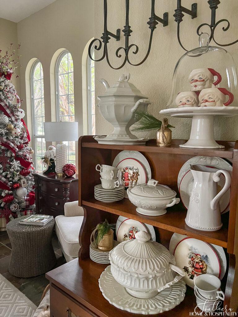 Christmas decor with white dishes in hutch