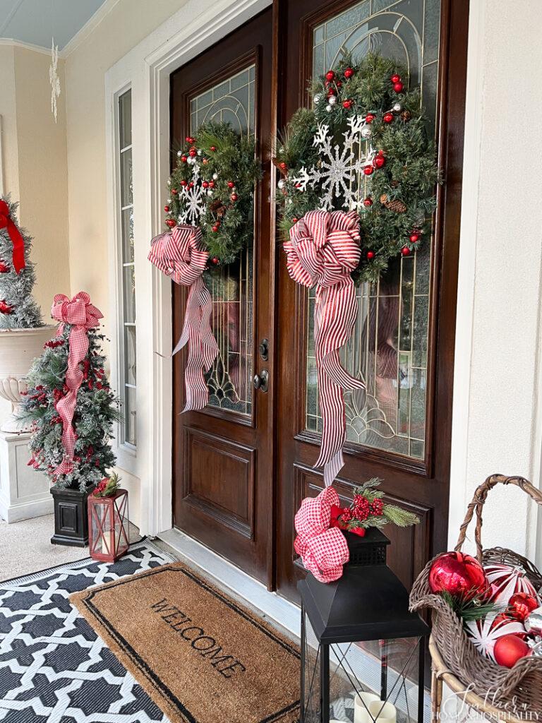 Double front doors with Christmas wreaths